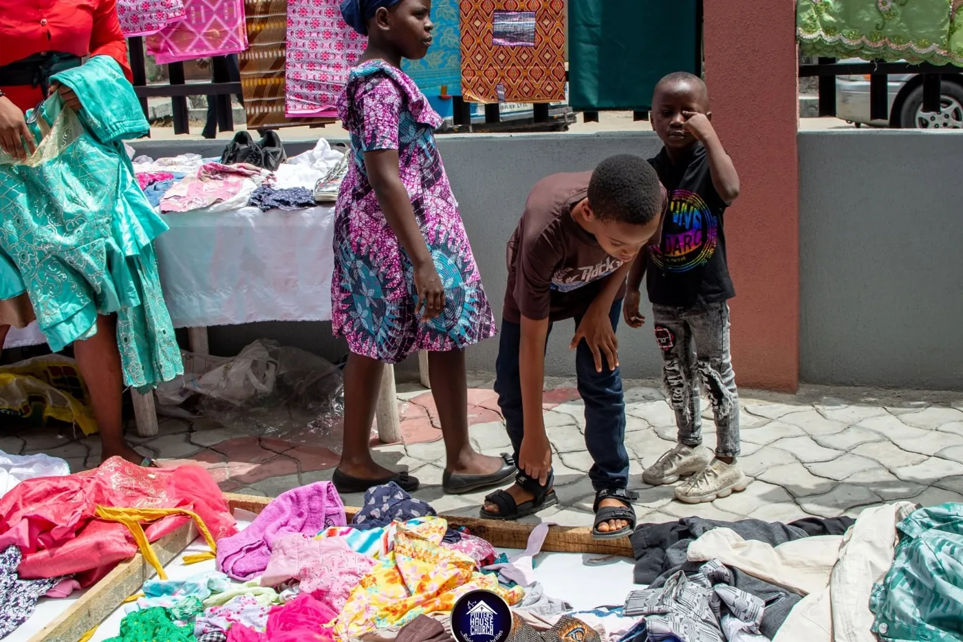 Children viewing clothing during the outreach
