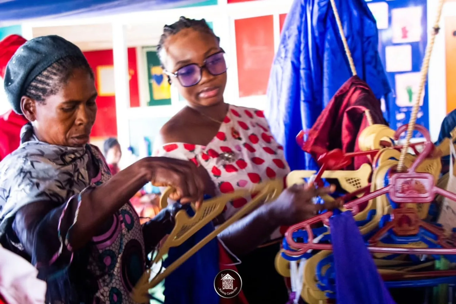 A beneficiary choosing clothing during the December 2024 Shop for Free outreach