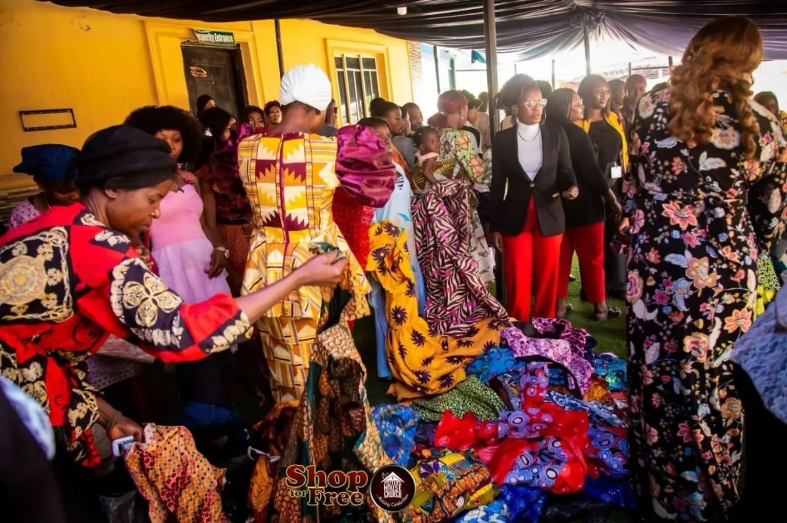 Community members selecting donated clothing at the December 2024 outreach