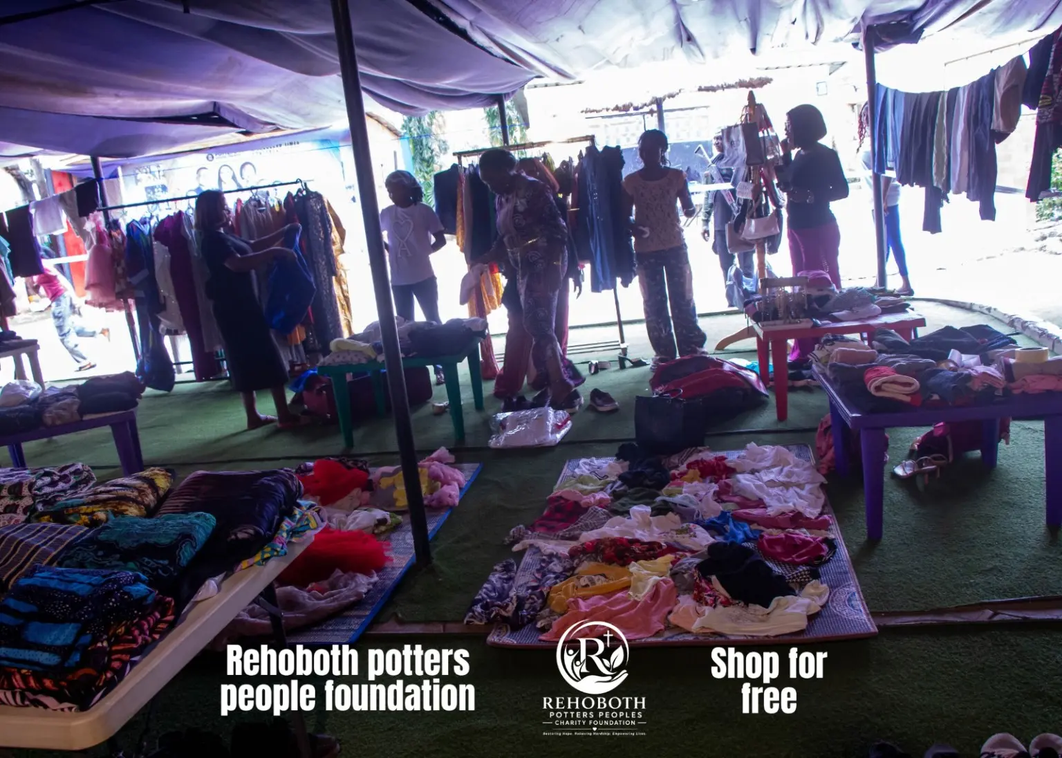 A participant selecting clothing at the outreach