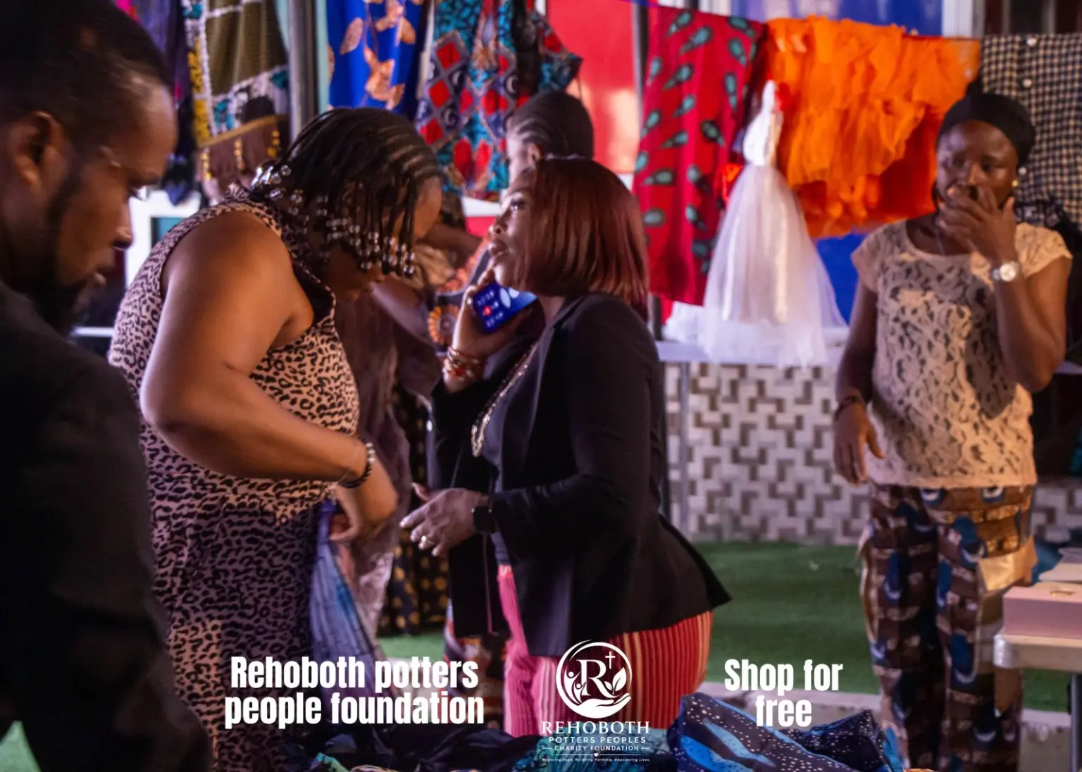 Women selecting items during the outreach